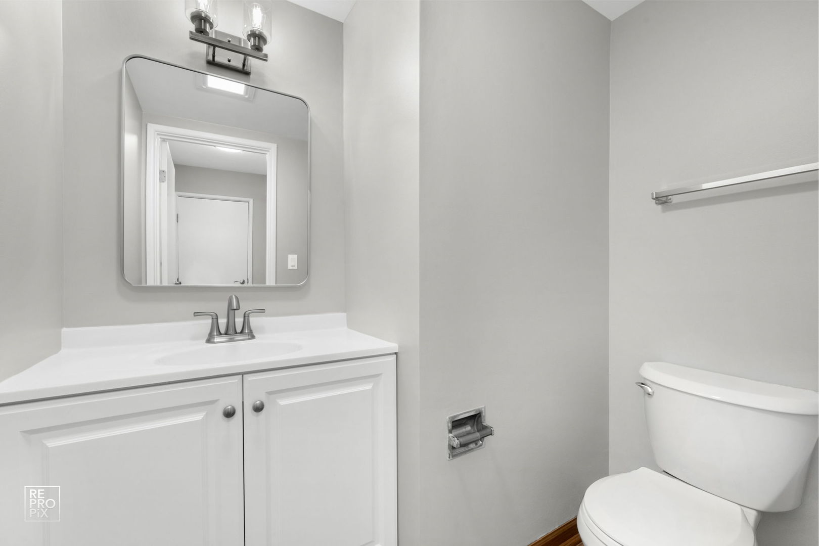 524 Jordan Way Bolingbrook, IL 60440 - Photo 10 of 16 a bathroom with a toilet sink and mirror