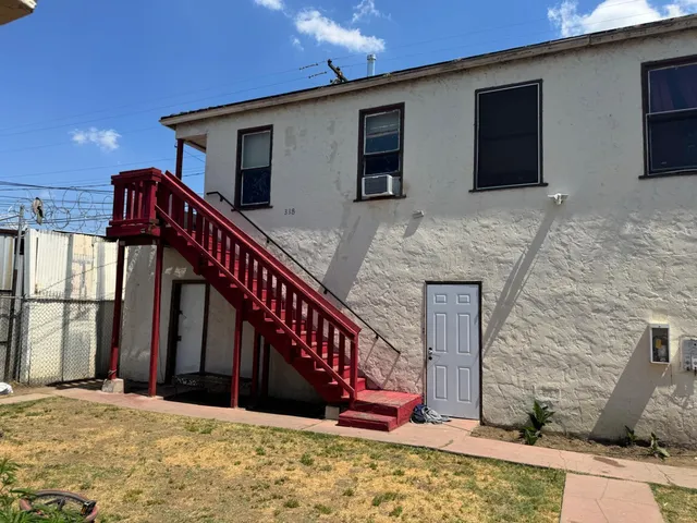 a view of wooden house with a large window