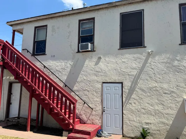 a front view of house with stairs
