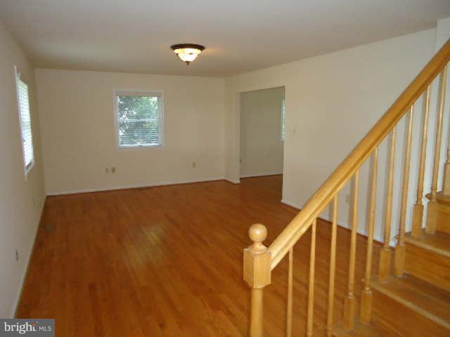 6838 Warfield Road Gaithersburg, MD 20882 - Photo 3 of 17 a view of room and stairs