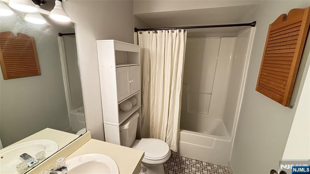 308-310 Passaic Avenue, Unit 201 Harrison, NJ 07029 - Photo 12 of 31 a bathroom with a sink toilet and shower