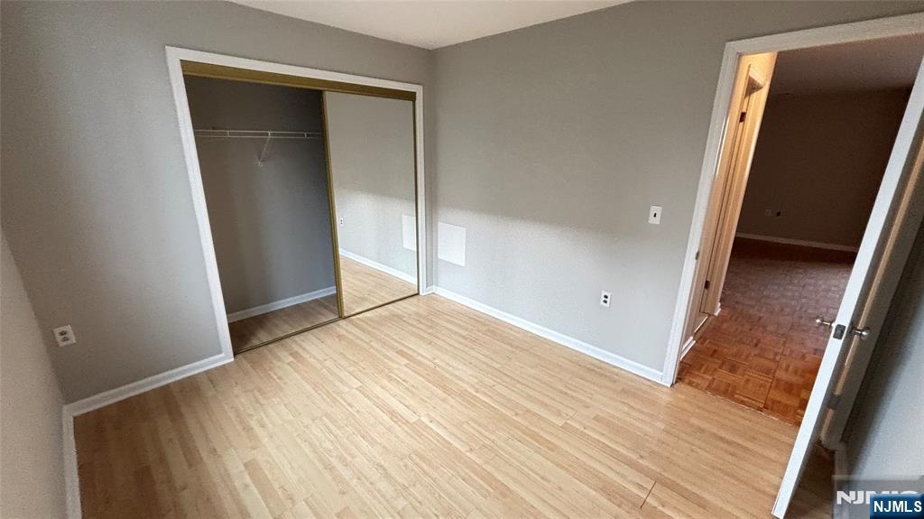 308-310 Passaic Avenue, Unit 201 Harrison, NJ 07029 - Photo 15 of 31 an empty room with wooden floor and entrance