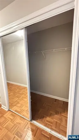 a view of hallway with wooden floor