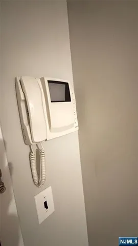 a view of a livingroom with wooden floor and a window