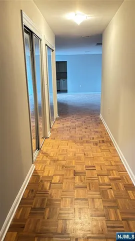 a view of an empty room with a door