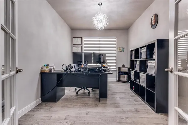 a room with furniture and a bookshelf