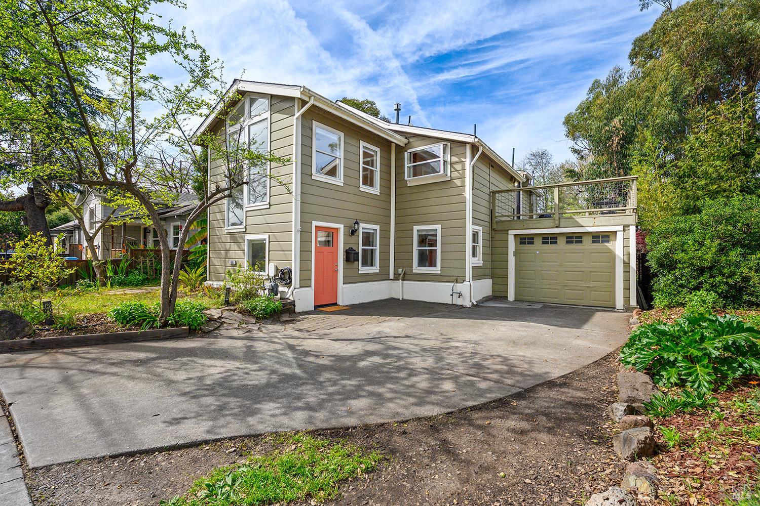 1005 Clark Street Santa Rosa, CA 95404 - Photo 1 of 1 a front view of a house with a yard and a garage