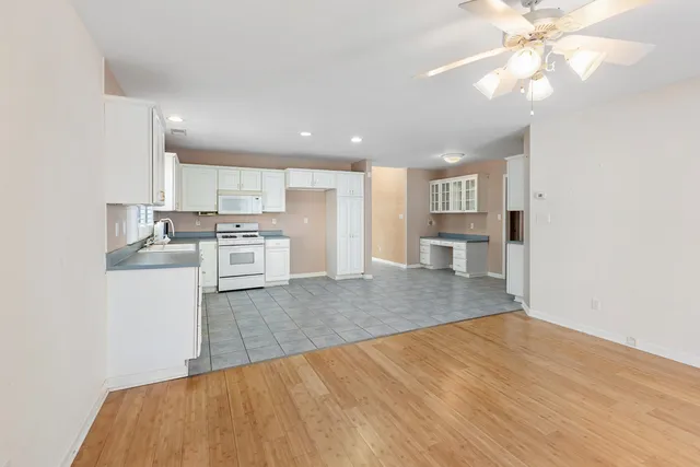 a view of kitchen with wooden floor