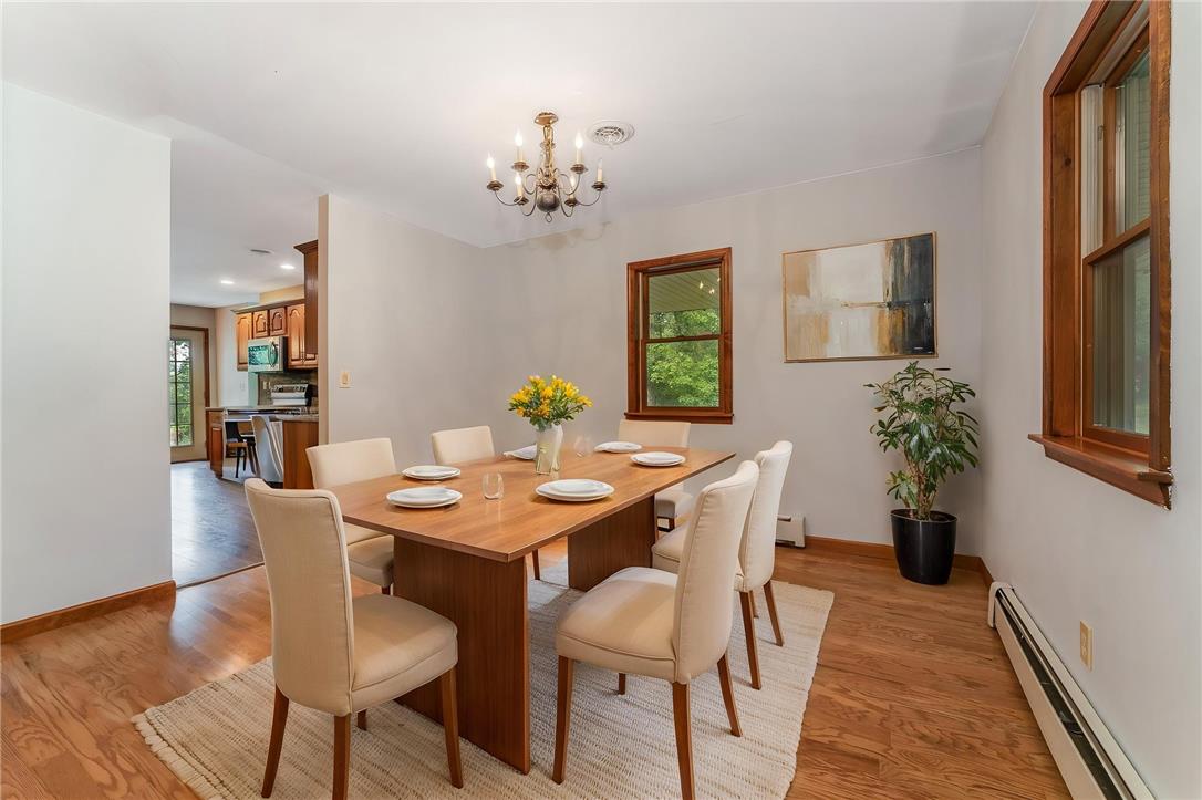 465 Raubsville Road Easton, PA 18042 - Photo 15 of 60 Virtually staged. Hardwood floors and generous natural light elevate this inviting dining area, ideal for gathering.