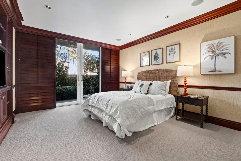 100 Royal Palm Way, Unit D1 Palm Beach, FL 33480 - Photo 13 of 22 a bed room with a bed and a chair