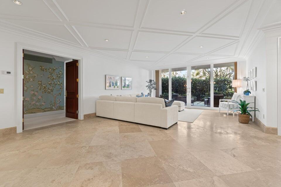 100 Royal Palm Way, Unit D1 Palm Beach, FL 33480 - Photo 17 of 22 a living room with a large bed and a large window