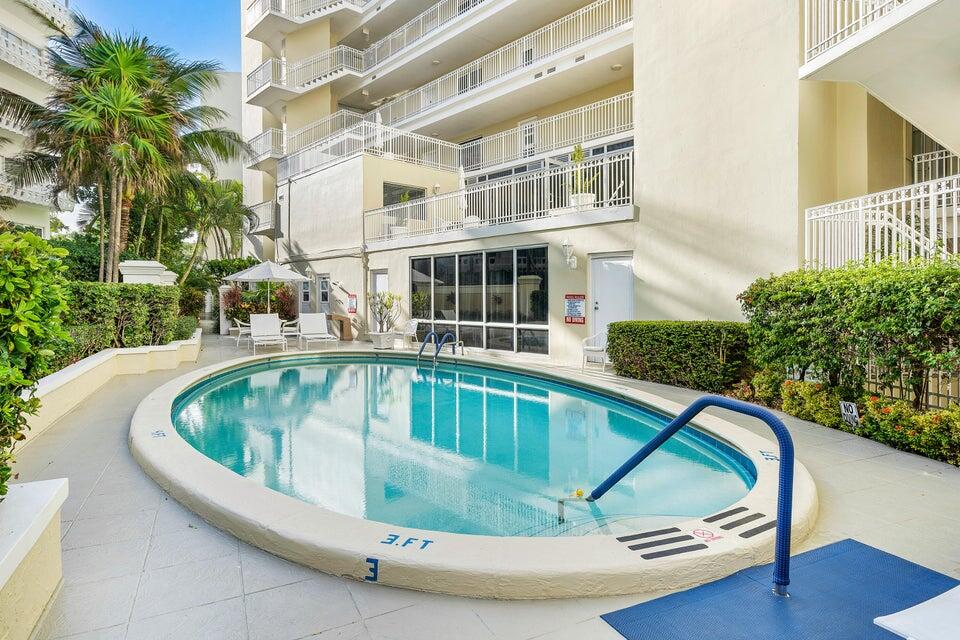 100 Royal Palm Way, Unit D1 Palm Beach, FL 33480 - Photo 21 of 22 a view of swimming pool with outdoor seating and plants
