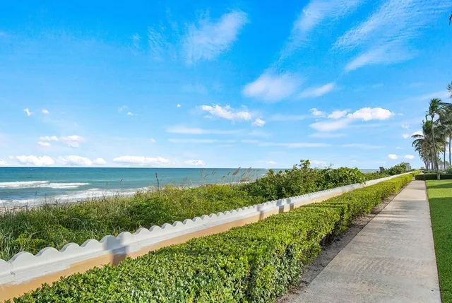 a view of an ocean and a yard