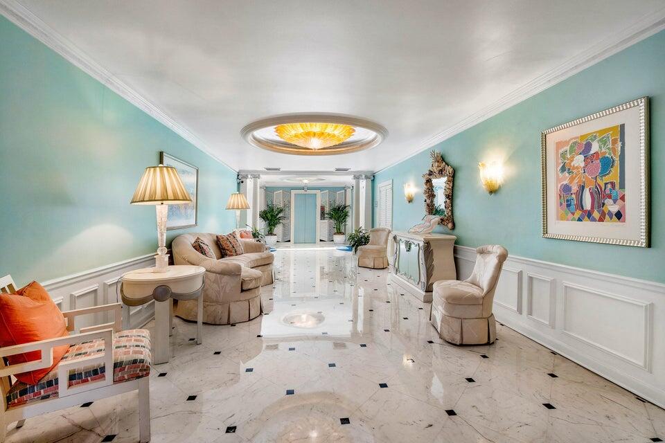 100 Royal Palm Way, Unit D1 Palm Beach, FL 33480 - Photo 4 of 22 a living room with furniture and a large window