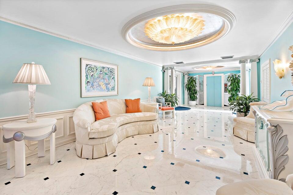 100 Royal Palm Way, Unit D1 Palm Beach, FL 33480 - Photo 5 of 22 a living room with furniture and a large window