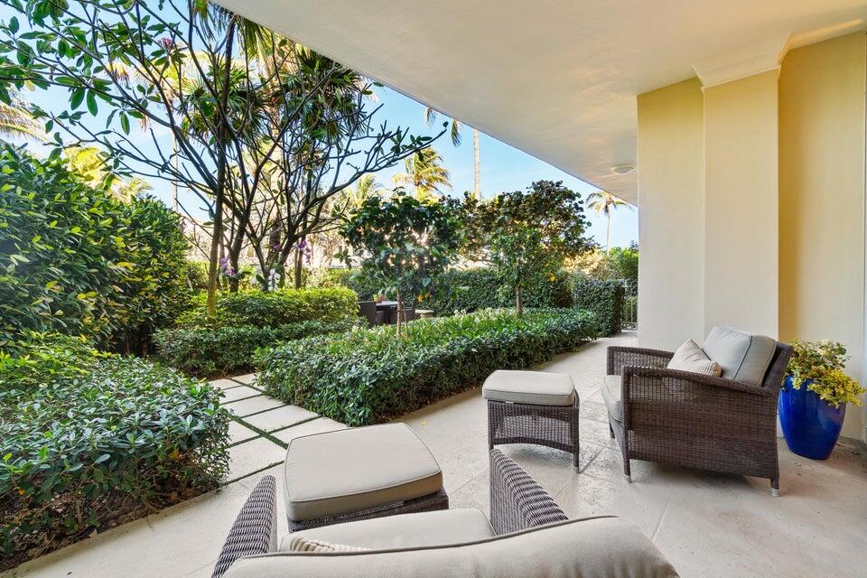 100 Royal Palm Way, Unit D1 Palm Beach, FL 33480 - Photo 9 of 22 a view of a patio with couches and a fire pit