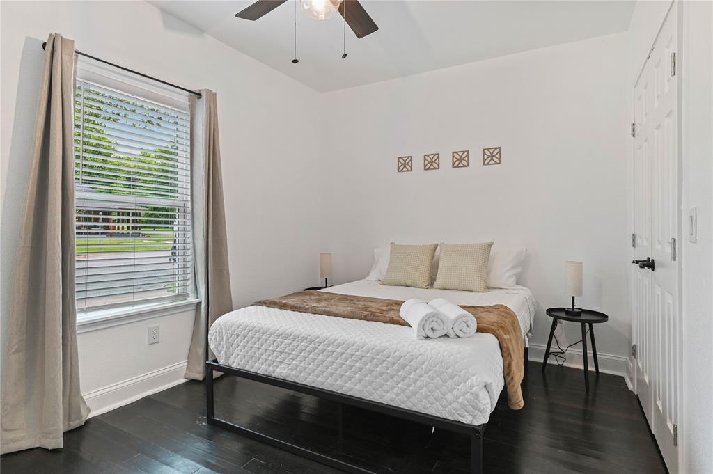 1106 West Chestnut Street Denison, TX 75020 - Photo 27 of 38 Bedroom featuring dark wood-type flooring and ceiling fan