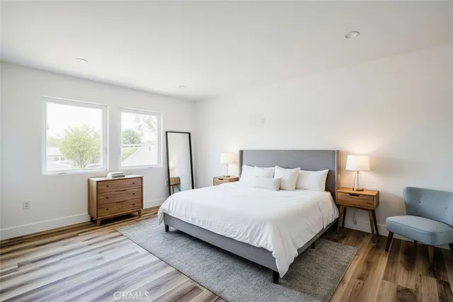 a bedroom with a bed and a couch