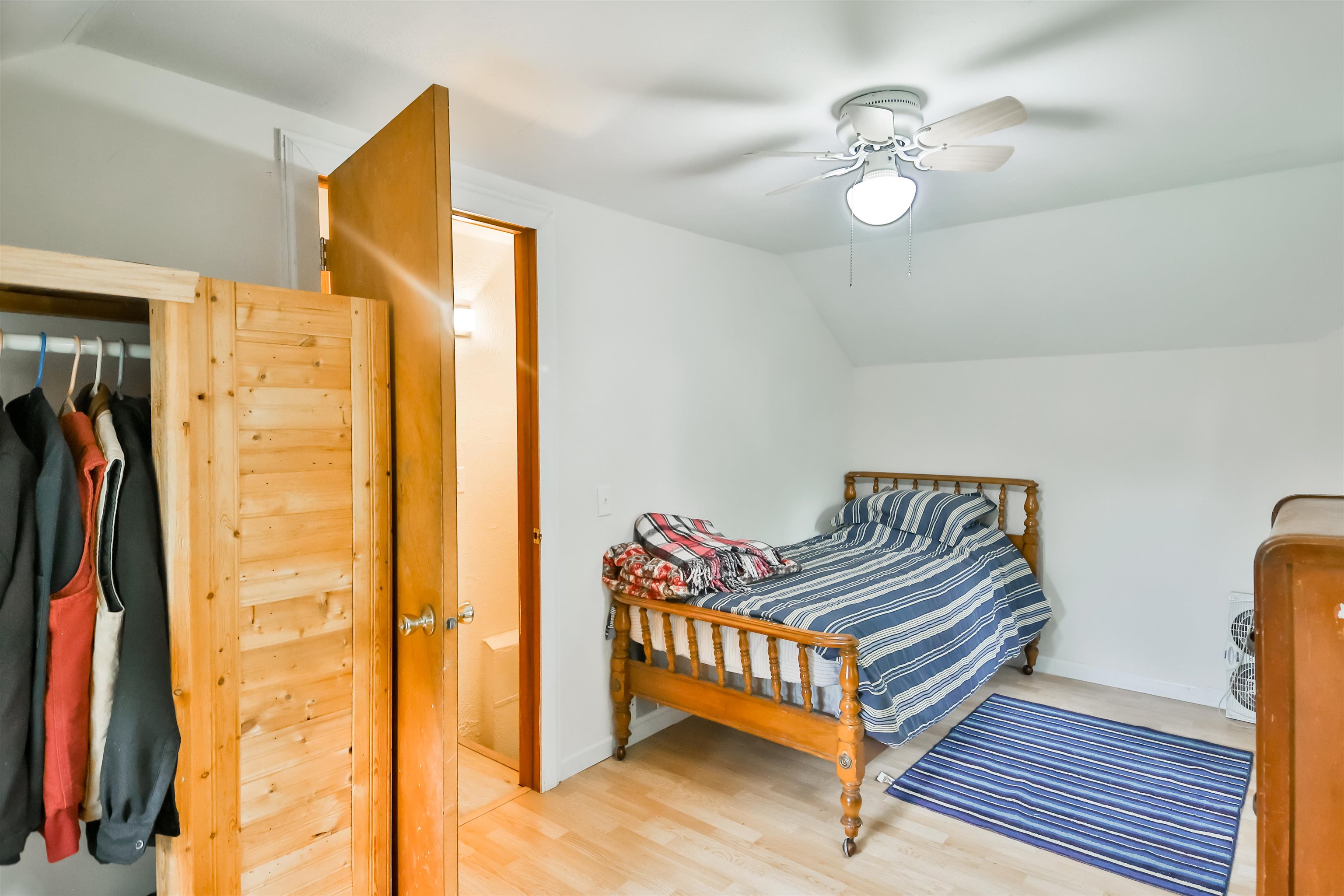 7719 West Coffman Road German Valley, IL 61039 - Photo 35 of 38 a bedroom with a bed and a chandelier