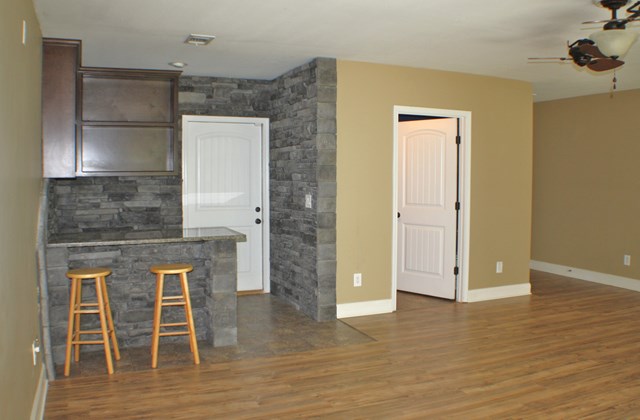 23 Isbell Road Fort Mitchell, AL 36856 - Photo 16 of 37 a view of kitchen with granite countertop cabinets and wooden floor