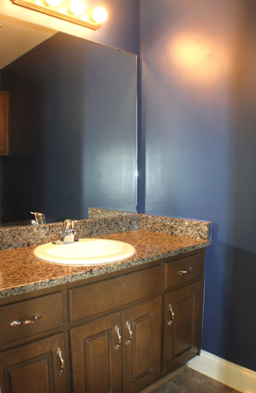 23 Isbell Road Fort Mitchell, AL 36856 - Photo 19 of 37 a bathroom with a granite countertop sink and vanity