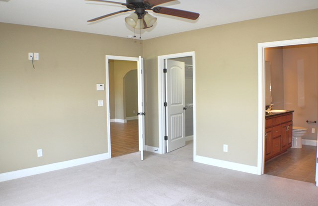 23 Isbell Road Fort Mitchell, AL 36856 - Photo 24 of 37 an empty room with chandelier fan and kitchen view