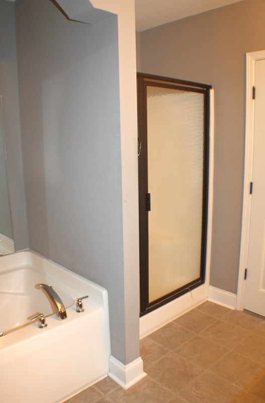 23 Isbell Road Fort Mitchell, AL 36856 - Photo 28 of 37 a bathroom with a tub and a window