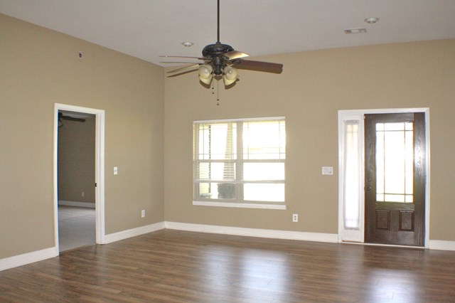 23 Isbell Road Fort Mitchell, AL 36856 - Photo 3 of 37 a view of an empty room with wooden floor and a window