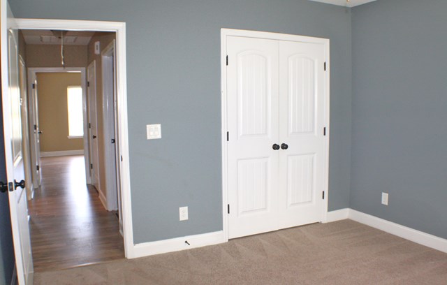 23 Isbell Road Fort Mitchell, AL 36856 - Photo 32 of 37 an empty room and wooden door