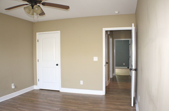 23 Isbell Road Fort Mitchell, AL 36856 - Photo 34 of 37 an empty room and a gallery with wooden floor