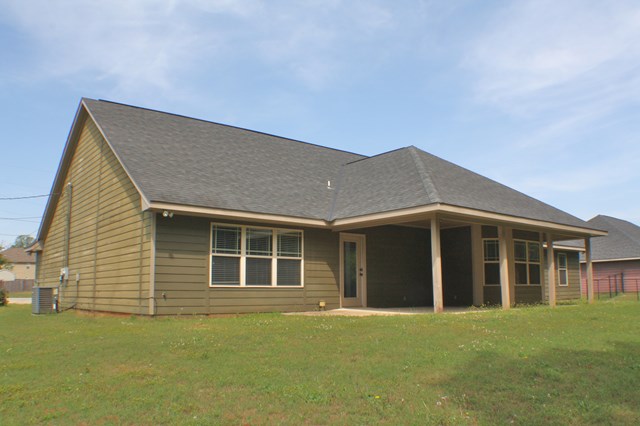 23 Isbell Road Fort Mitchell, AL 36856 - Photo 36 of 37 a front view of a house with a garden