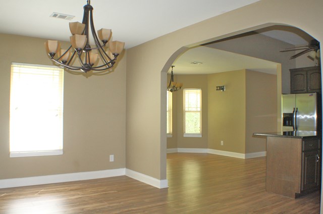 23 Isbell Road Fort Mitchell, AL 36856 - Photo 7 of 37 a view of a livingroom with wooden floor and windows