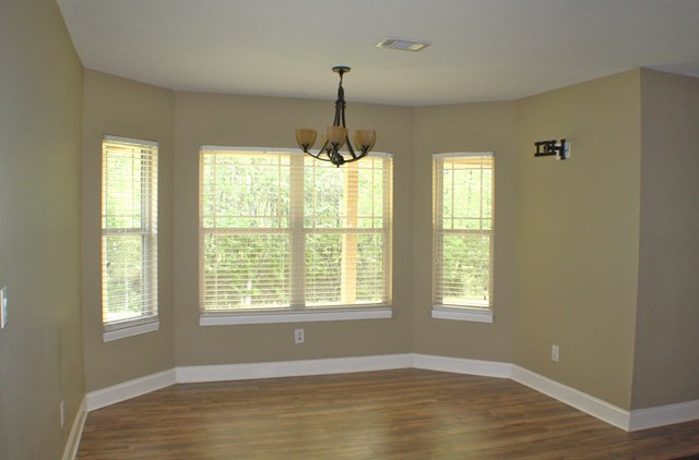 23 Isbell Road Fort Mitchell, AL 36856 - Photo 8 of 37 a view of an empty room with glass windows and chandelier