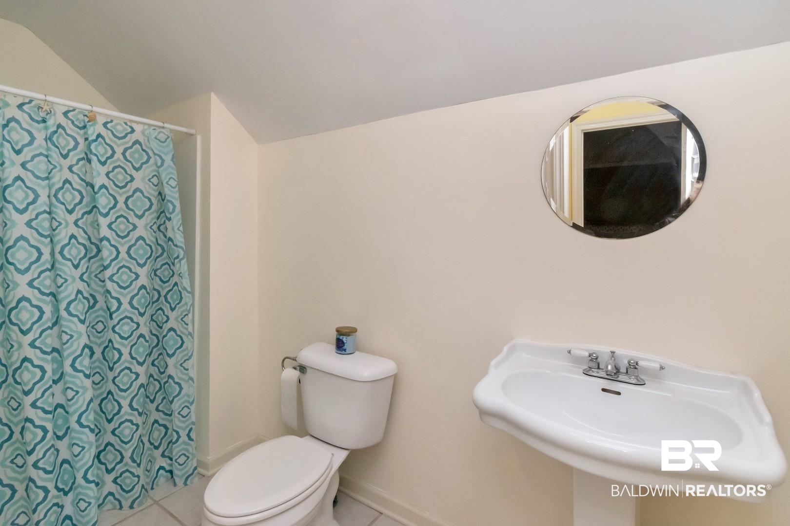 1050 Southern Way Court Mobile, AL 36609 - Photo 27 of 36 Bathroom featuring lofted ceiling, tile patterned floors, toilet, and sink