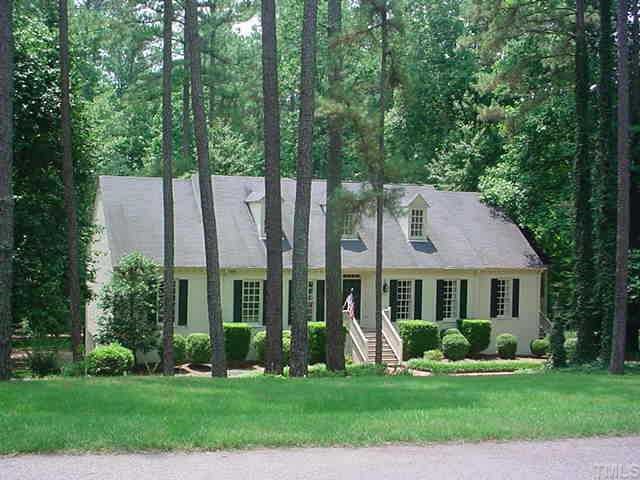 9613 Post Mill Place Raleigh, NC 27615 - Photo 1 of 1 a front view of a house with a yard and trees