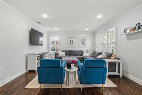 a living room with fireplace furniture and a flat screen tv