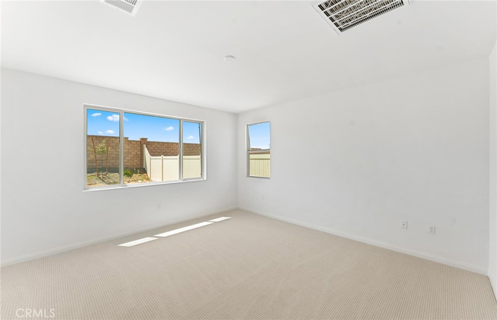 26615 Silver Ore Road Menifee, CA 92570 - Photo 17 of 30 a view of an empty room with a window