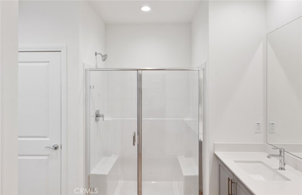 26615 Silver Ore Road Menifee, CA 92570 - Photo 20 of 30 a bathroom with a sink and a shower