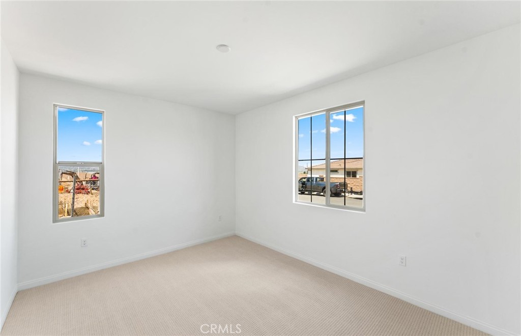 26615 Silver Ore Road Menifee, CA 92570 - Photo 23 of 30 an empty room with windows