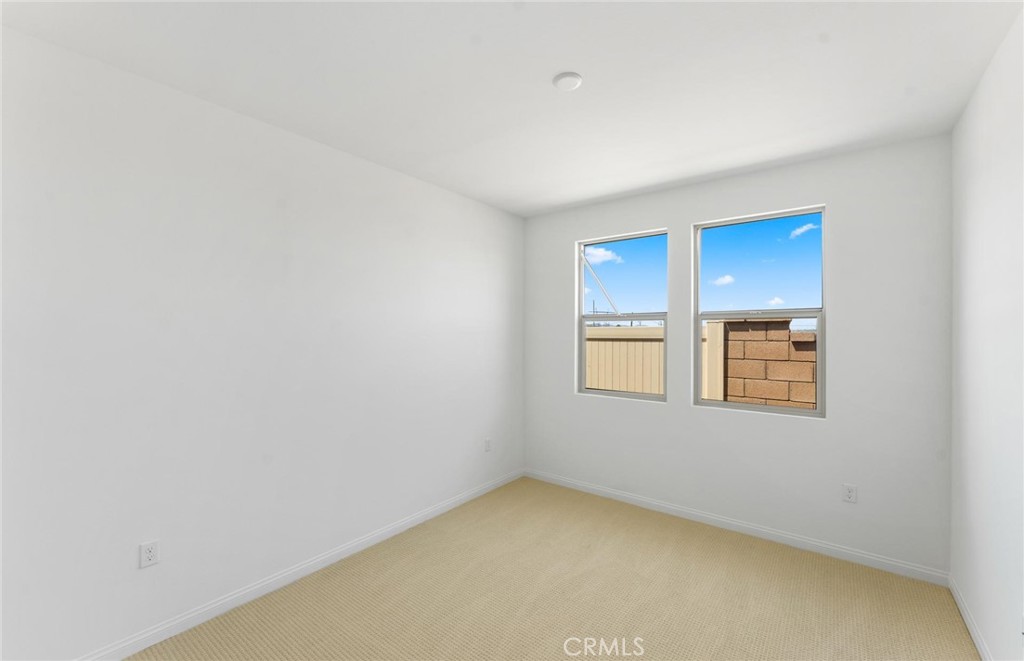 26615 Silver Ore Road Menifee, CA 92570 - Photo 25 of 30 a view of an empty room with a window