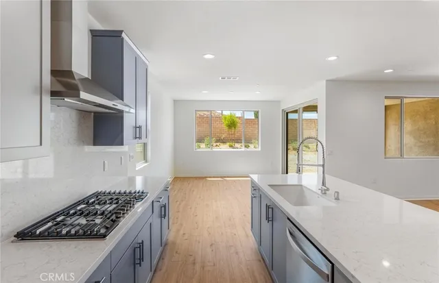 a kitchen with counter top space and stainless steel appliances