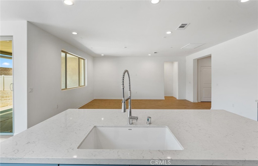 26615 Silver Ore Road Menifee, CA 92570 - Photo 10 of 30 a bathroom with a sink and a mirror