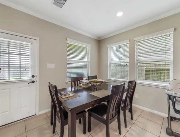 a kitchen with kitchen island granite countertop a stove oven and a sink with granite countertops