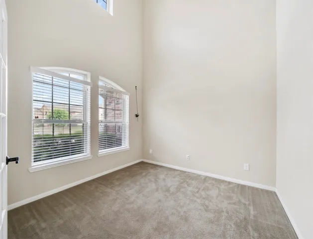 a large bathroom with a sink mirror and a bathtub