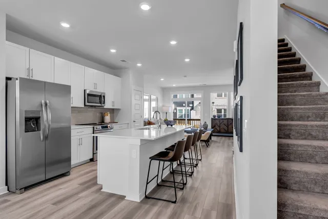 a kitchen with cabinets and stainless steel appliances