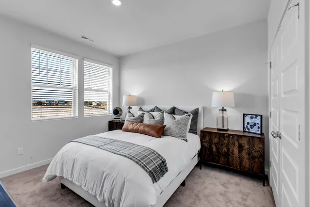 a bedroom with bed and window