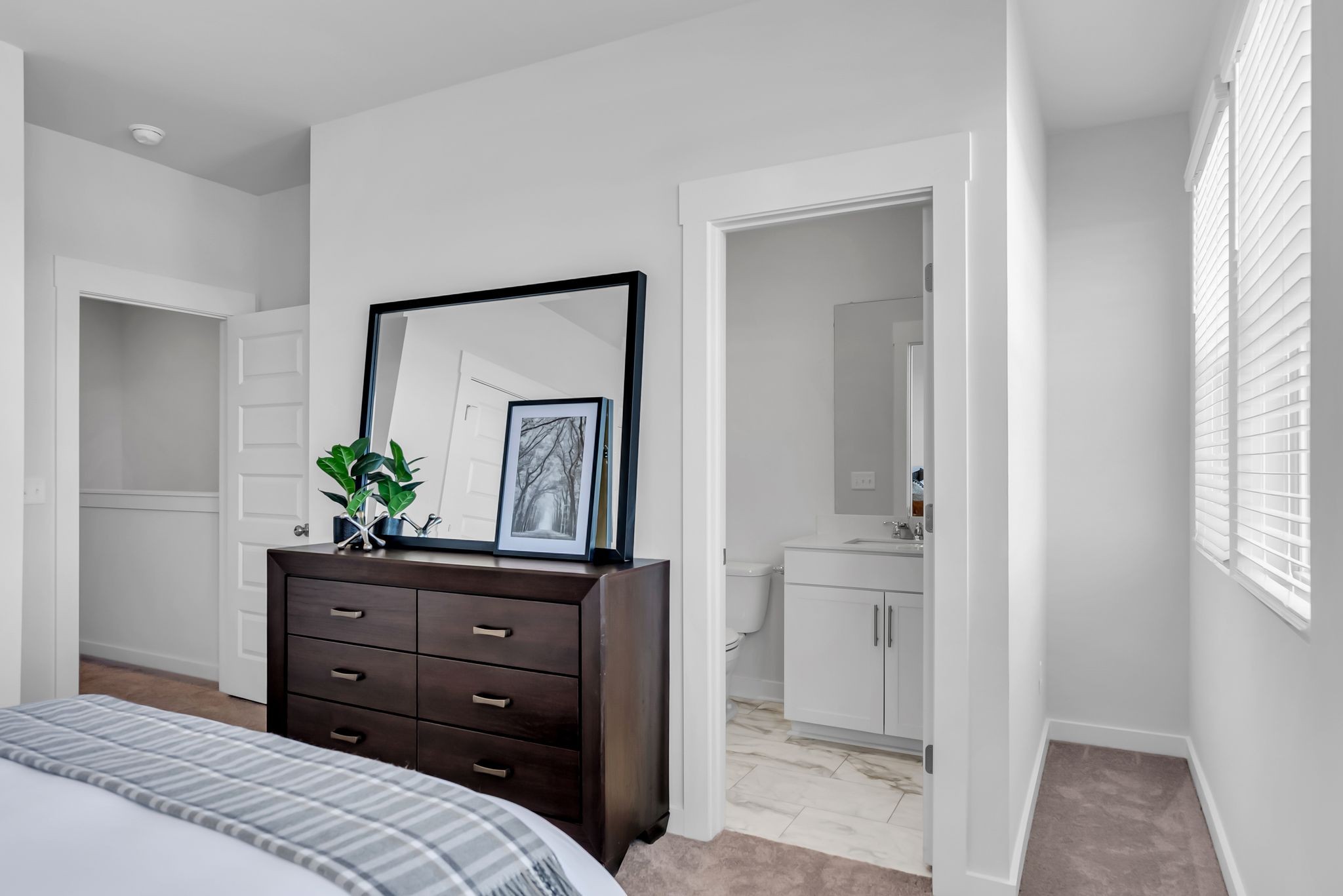 516 Hinton Street Lebanon, TN 37090 - Photo 20 of 24 a bedroom with a bed and a potted plant on the dresser