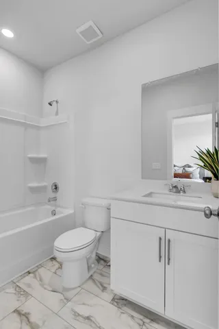 a bathroom with a sink a toilet and a bathtub