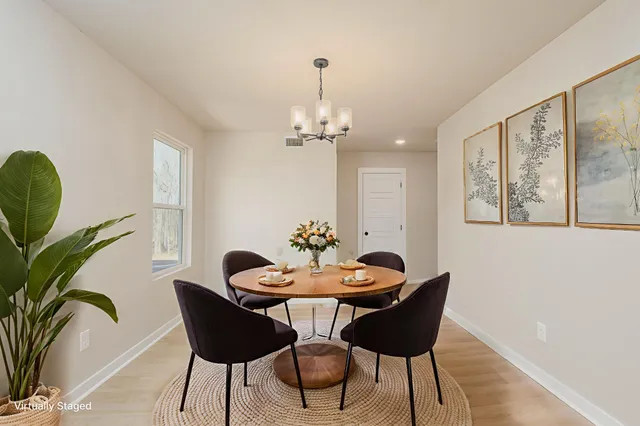 a dining room with furniture and window