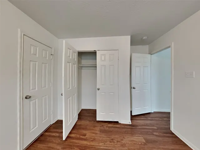 a view of a livingroom with wooden floor